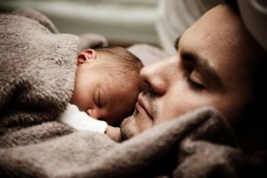 father napping with baby