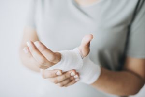 bandaged hand in pain